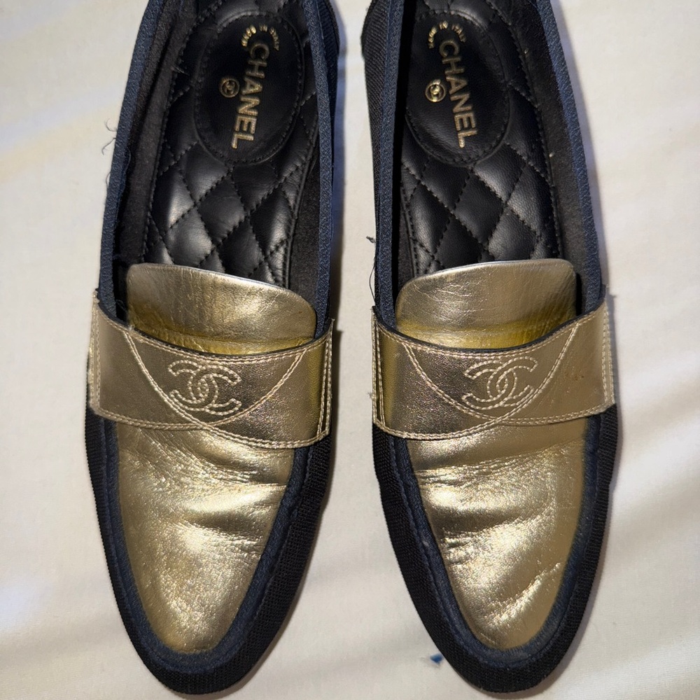 CHANEL Gold and Black Loafers